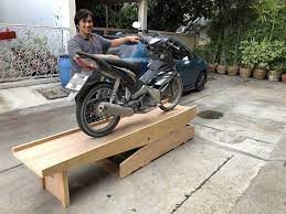 Homemade motorcycle lift constructed from 3/4 plywood, gi pipe, and wooden planks. Wwii Wooden Motorcycle Workbench Global Dimension