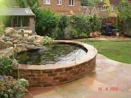 We start every project by providing. A Raised Pond Like This Brick One Makes Caring For The Fish And The Water Much Easier Ponds Backyard Raised Pond Garden Pond Design
