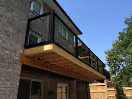 This balcony sports pops of yellow in planters and the railing. What S The Best Material For Balcony Railings