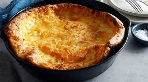 A Cross Between A Giant Gougere And A Savory Clafoutis This Cheese Filled Puffy Pancake Makes An Unexpected Savory Dutch Baby Recipe Savory Dutch Baby Recipes