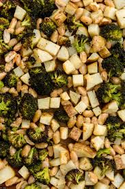 Roasted Garlic Potatoes And Broccoli With Crispy White Beans Inspiralized Recipe In 2020 Garlic Roasted Potatoes Broccoli And Potatoes Broccoli