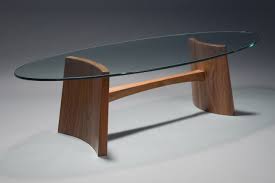 Glass can be cut and bent into many different shapes and is extremely easy to clean (no more worrying about the coasters!) making it a popular material. Clearwater Coffee Table Hardwood Glass Coffee Table Seth Rolland