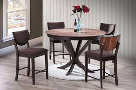 It's probably the height you think of when someone says dinner table. standard height tables are about 30 high and dining chairs are about 18 high. Turner Round Pub Table 4 Stools At Gardner White