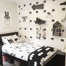 A wall decal is showing batman's sign in a yellow beam of light in the bluish sky above gotham in black, greys, blues and yellows. 19 Black And White Boys Bedroom Ideas Big Boy Room Boy Room Boys Bedrooms