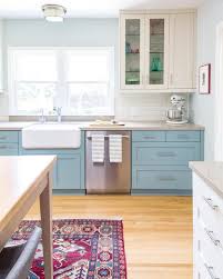 After white, blue is probably one of the most popular kitchen colors. Blue And White Kitchen Decor Robin S Egg Blue Lower Cabinets Cream Uppers And Boho Colorful Rug In All White Kitchen White Kitchen Decor Small Kitchen Plans