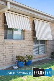These Auto Roll Up Awnings Provide Great Sun Protection While Giving This House A Cosy Look Awning House Awnings Metal Awnings For Windows