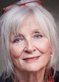 What is a good haircut for a 60-year-old with a round face and side bangs  in Murfreesboro, TN?