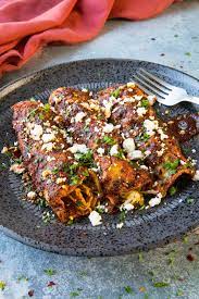 This easy mexican enchiladas recipe takes only 30 minutes to prepare for a filling family meal. Chicken Enchiladas Recipe Chili Pepper Madness