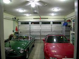The outdoor garage light shown here has two lamps and an infrared motion sensor, which automatically turns on. Pin On Storage And Organization