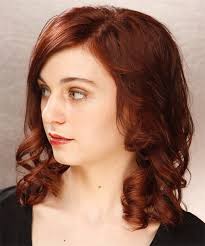 Redheads often try to get away from the fiery hues and mahogany hair dye is what can do the trick. Medium Curly Dark Mahogany Red Hairstyle