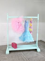 This will stabilize the clothes rack and you'll still have plenty of hanging room on the ends and in the middle. Diy Kids Wardrobe Rack Jaime Costiglio