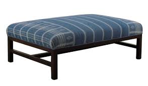 Tailored pleated skirt conceals an open shelf for hiding remotes and magazines. Ottomans Rooms Gardens