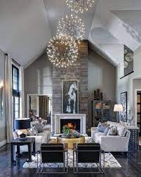 Centered above coffee table or living room ceiling, type/size of chandelier is selected based on the living room size and other lights in the room (e.g. Top 50 Best Living Room Lighting Ideas Interior Light Fixtures