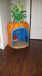 Trimming the roof was tricky because we just used a box cutter to cut along the peak shape. I Made A House For My Dog Sponge Bob Style It S Made Of Cardboard And Paper Mache Somethingimade