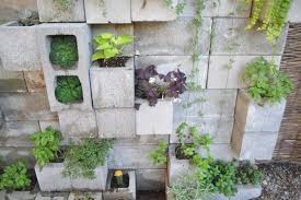Budget Backyard 10 Ways To Use Cheap Concrete Cinder Blocks Outdoors Apartment Therapy Apartment Garden Budget Backyard Cinder Block Garden