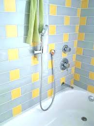 The light gray and white color palette really brightens and opens up the space, while the crosshatch floor tiles, antique mirror, warm brass fixtures and hardware warm things up, striking a. Yellow Bathroom Ideas