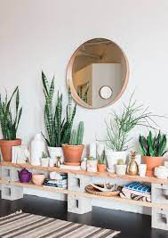 How To Display Houseplants 65 Of Our Favorite Plant Display Ideas Apartment Therapy In 2020 Green Interior Design Living Room Plants Decorating Blogs