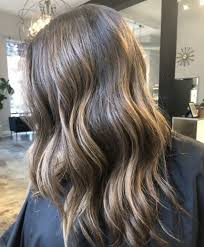 Curls styled with working spray from blonde bun, platinum blonde hair, icy blonde, blonde hair purple roots, grey hair with dark. 5 Things You Need To Know About Getting Lowlights All Things Hair Uk