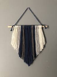 Check out these ideas and fun tutorials this will look great on your covered patio which will give it a bohemian fix indeed. Navy Yarn Wall Hanging Boho Wall Hanging Modern Dream Etsy Yarn Wall Hanging Boho Wall Hanging Yarn Wall Art