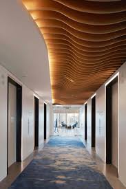 A Wood Finish That Dampens Sounds Soft Sound Wood Finish Acoustic Systems Architecture Ceiling Acoustical Ceiling Ceiling Design