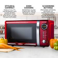 The microwave uses 1000 watts to deliver cook food faster and perfectly. Nostalgia Rmo7rr Retro 0 7 Cu Ft 700 Watt Countertop Microwave Oven 12 Pre Programmed Cooking Settings Digital Clock Easy Clean Interior Metallic Red Buy Online At Best Price In Uae Amazon Ae