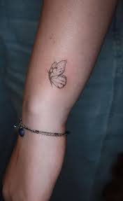 Black and grey butterfly tattoo on forearm. 30 Simple Butterfly Tattoo Ideas