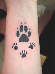 There's no doubt that people love their dogs. Tribal Dog Paw Tattoos Shefalitayal