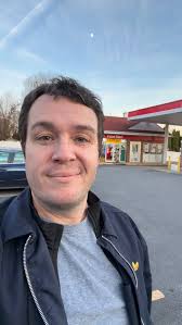 Mayor Phil Dague begins the No Kings protest organized by Indivisible  Chester County in West Chester, PA. After talking about the goals of the  day, he introduces Rev. Josh Gill, a local