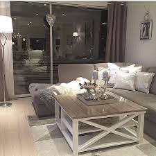 A white fireplace and ceiling beams balance dark walnut floors. Inspirational Living Room Ideas Living Room Design Gray White And Brown Living Room