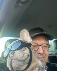 Greg Gutfeld! with Gus. No similarities at all.😎🤣