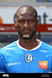In this July 3, 2018 photo, Mamadou Aliou Barry, left, departed from his  native Guinea in West Africa when he was 14, a few years ago, waits for  entry to the U.S.
