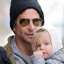 Bradley Cooper's daughter, Lea, is stealing hearts as her dad's perfect  mini-me! From her bright eyes to her infectious smile, the resemblance is  undeniable. Fans are loving this adorable father-daughter duo—proof that
