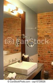 Brick walls fit in with a variety of styles, and with the right sealant or finish, they can be used with ease in the bathroom as well. Modern Bathroom With Brick Wall Modern Bathroom In A Boutique Hotel With Brick Wall Canstock