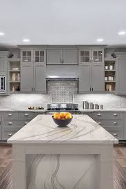 Dark kitchen cabinets can sometimes look too strong and overwhelming, but a good way to tone it down is to use a light colored countertop and a light colored kitchen island. 44 Gray Kitchen Cabinets Dark Or Heavy Dark Light Modern