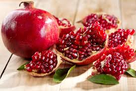 The leaves are glossy, dark green, and somewhat leathery; Pomegranate Big Red Variety