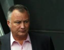 NHS nurse suspended for posing next to black colleague wearing a paper  napkin KKK hood