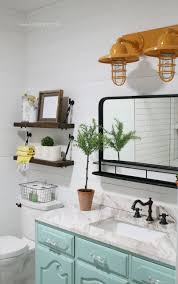 Contemporary bathroom with elaborate vanity design lit up fashionably. Barn Light Electric Farmhouse Bathroom Vanity Lights Lolly Jane Aqua Bathroom Decor Farmhouse Bathroom Farmhouse Bathroom Decor