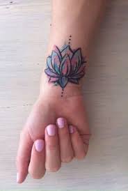 50 Gorgeous Yet Delicate Flower Tattoo Designs For Your Own Inspiration Flower Wrist Tattoos Wrist Tattoos For Women Wrist Tattoo Cover Up