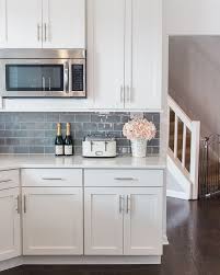 The emerald colored backsplash covering the wall from the counters up to the rustic wooden shelves. Shop My Instagram The Greenspring Home Gray Kitchen Backsplash Backsplash Kitchen White Cabinets Kitchen Cabinets Decor