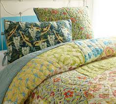 Of course, decorative throws can also be practical. Scalloped Organic Patchwork Quilt Shams Pottery Barn
