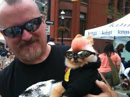 A man poses with his dog during Woofstock Saturday morning. The weekend festival draws 300,000 people and their pets to the city. (Jamie Gutfreund/CP24) - image