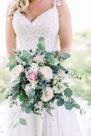 Bouquet with eucalyptus, roses and protea. Eucalyptus Blue Thistle And Rose Bouquet Blue Wedding Bouquet White Roses Wedding Pink Rose Wedding Bouquet