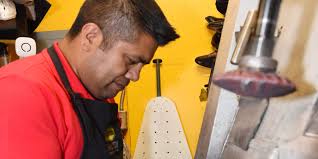 If the shoe fits: Refugio Contreras at work at C&F Shoe Repair