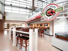 Airport restaurant groups are increasingly courting area breweries to serve local beers at their terminals through branded bars. Portland International Jetport Linda Bean S Perfect Maine