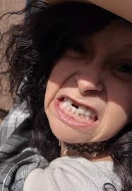 Wonen Climbing in A Window of A Truck