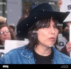 Can you name other famous people in Cher's music videos?