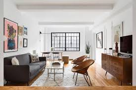 The key here is to make sure the rug is the right size, proportionally, for your couch. Grey Couch Decor Interior Decorating With Gray Sofa And Rugs