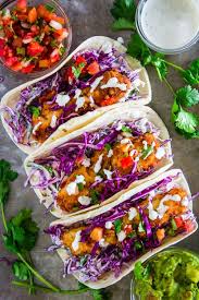 Cod fish tacos with easy cajun seasoned blackened cod, healthy avocado crema made with yogurt, and shredded cabbage. Crispy Baja Fish Tacos With Cod Simply Home Cooked
