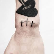 The world is inhabited by around 2 billion christians. Three Mini Blackwork Cross Tattoo Idea