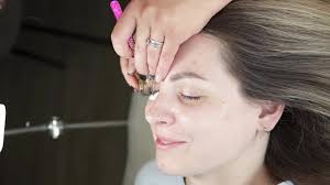 Cosmetologist Performs An Eyelash Extension Procedure In A Beauty Salon.